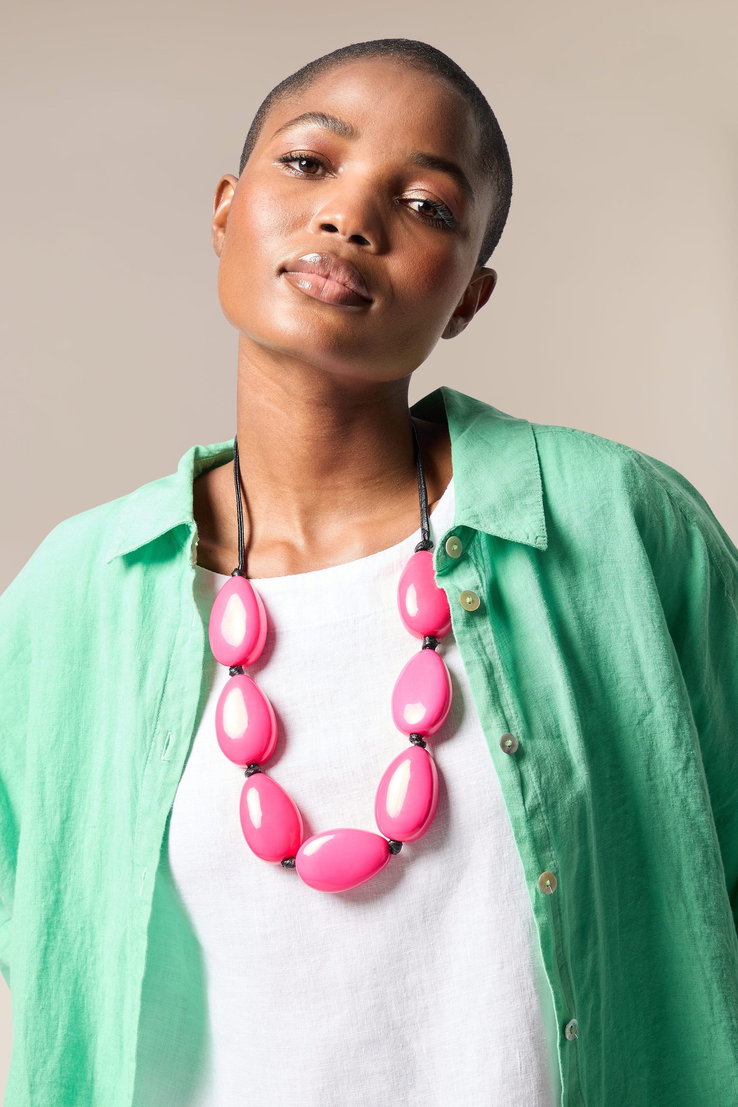 A woman wearing a Vibrant Bead Necklace.