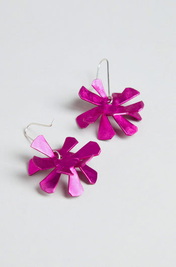 The Flower Earrings feature metallic pink anodised aluminium flowers with sterling silver hooks, showcased against a plain light background.