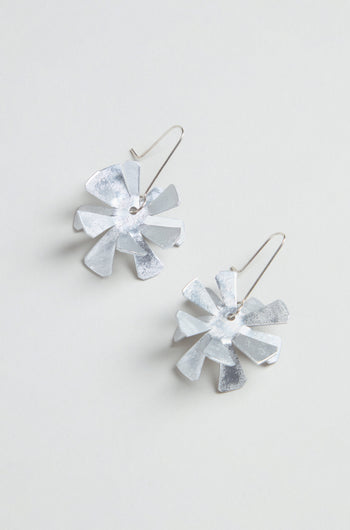 Flower Earrings: Silver metallic floral design crafted from anodised aluminium with sterling silver hooks, shown on a light grey background.