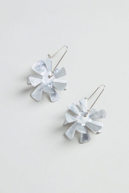 Flower Earrings: Silver metallic floral design crafted from anodised aluminium with sterling silver hooks, shown on a light grey background.