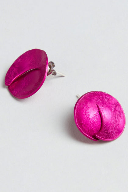Curved Disc Earrings in metallic pink, each featuring a groove detail and crafted from anodised aluminium with sterling silver posts, shown against a plain white background.