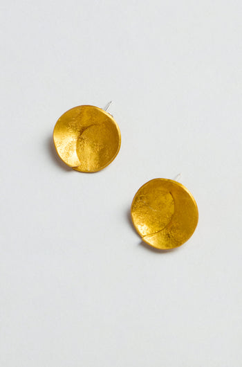 The Curved Disc Earrings feature a round, gold-toned, textured, overlapping design and are finished with secure sterling silver posts. Displayed against a light background.