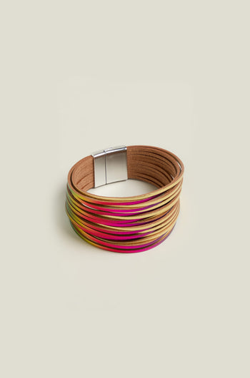 The Woven Metallic Bracelet is a colorful multi-strand twisted leatherette accessory with a magnetic clasp, featuring shades of beige, pink, and yellow against a plain background.