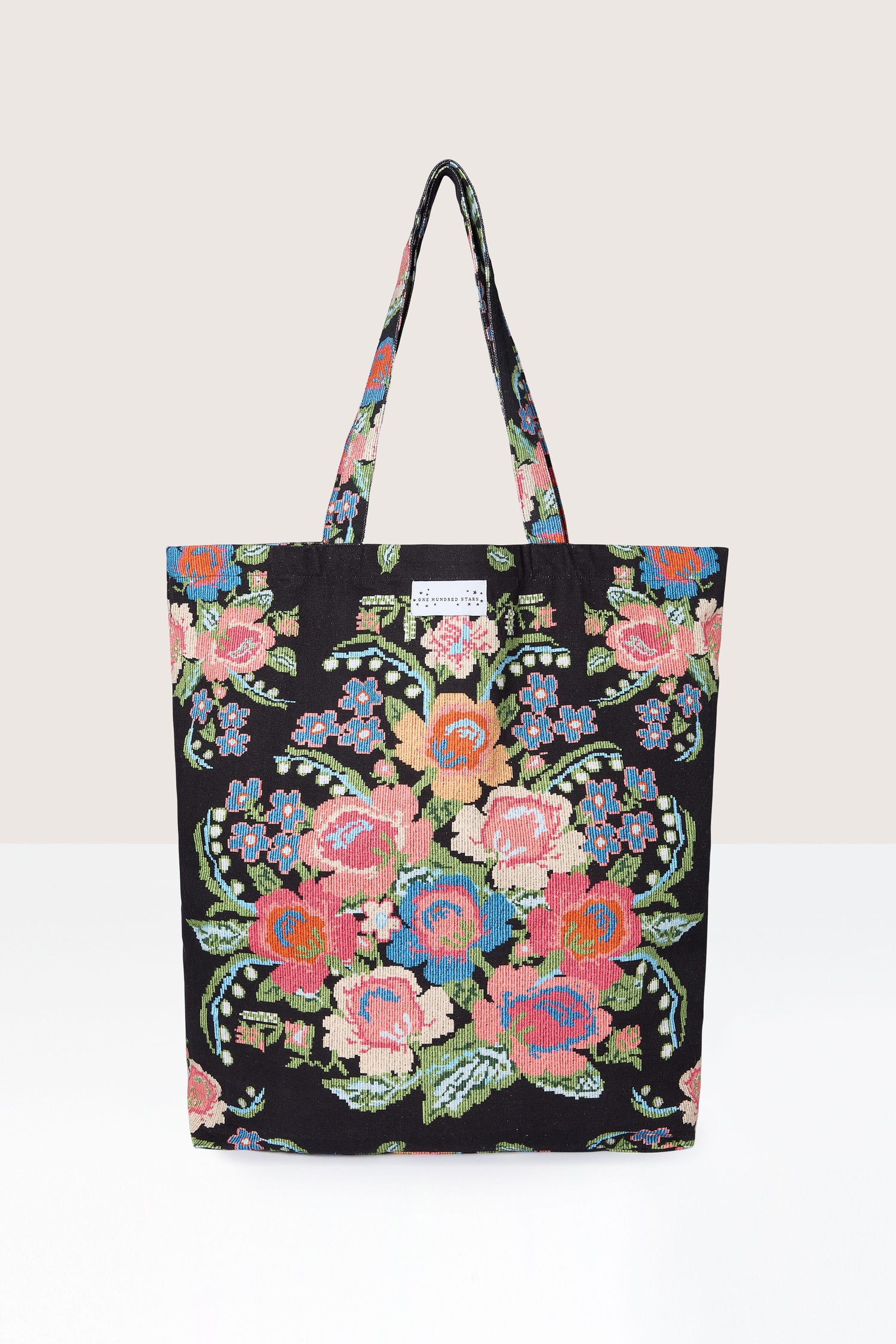 A sustainable Woven Flower Canvas Bag with an eco-friendly elegance and a woven flower print.