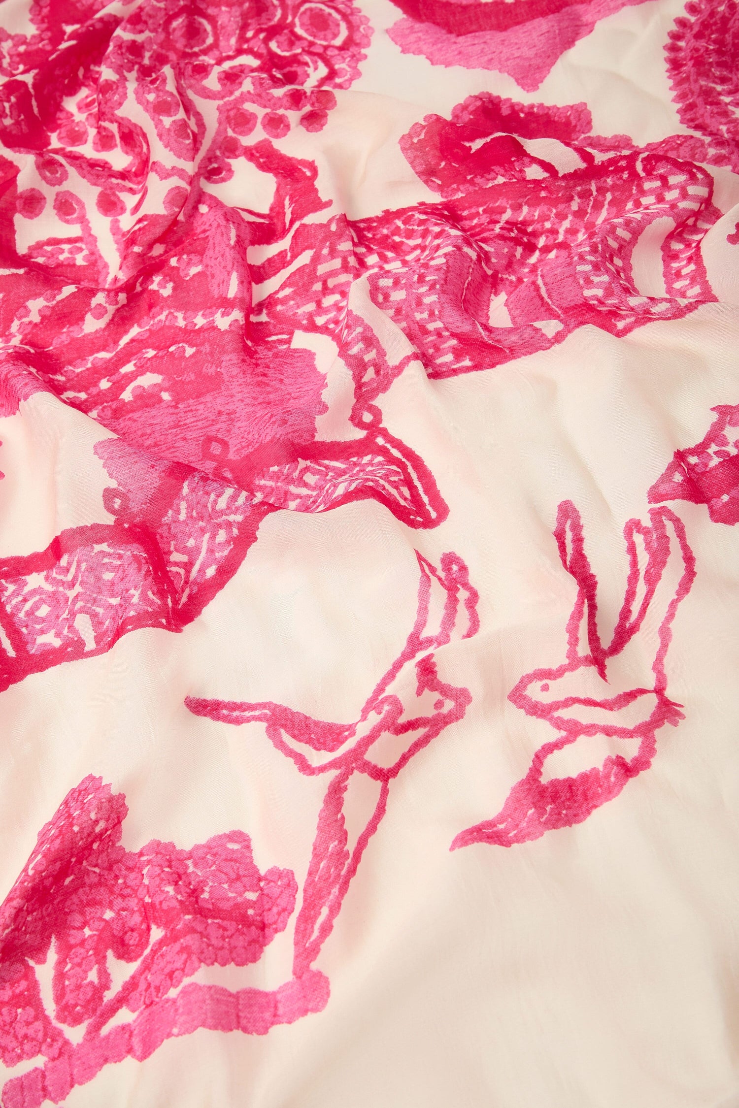 Pink lace fabric with floral print patterns on a white background, designed in a unique style for the Willow Print Scarf.