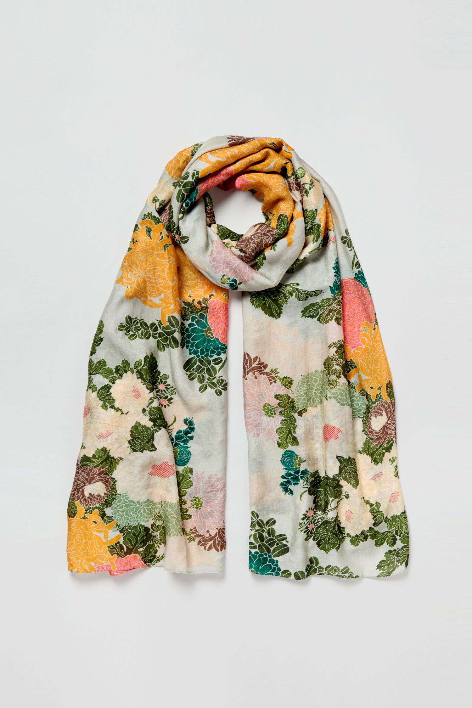 The Jacquard Scarf is a lightweight accessory with a vintage-inspired floral print in yellow, green, pink, and white tones, showcased on a plain background.