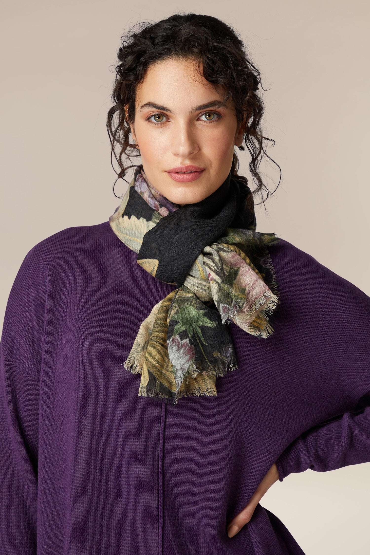 A woman wearing a vintage-inspired Daisy Print Woollen Scarf.