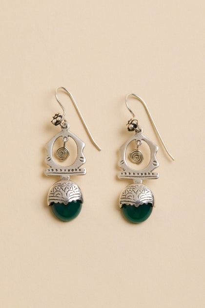 Green Onyx Drop Earrings: Sterling silver drops with spiral and geometric designs and green semi-circular stones, shown on a beige background.
