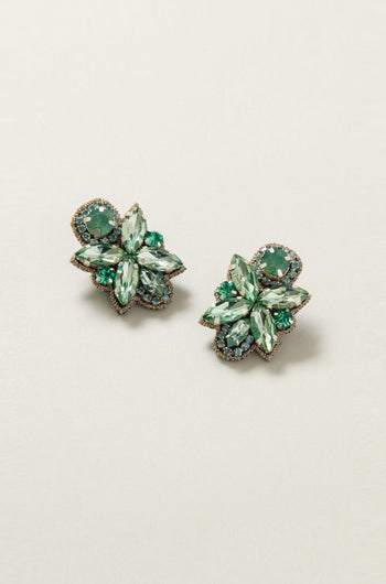 A pair of Hand Beaded Petal Earrings embellished with green gemstones and gold trim, showcased against a soft backdrop.