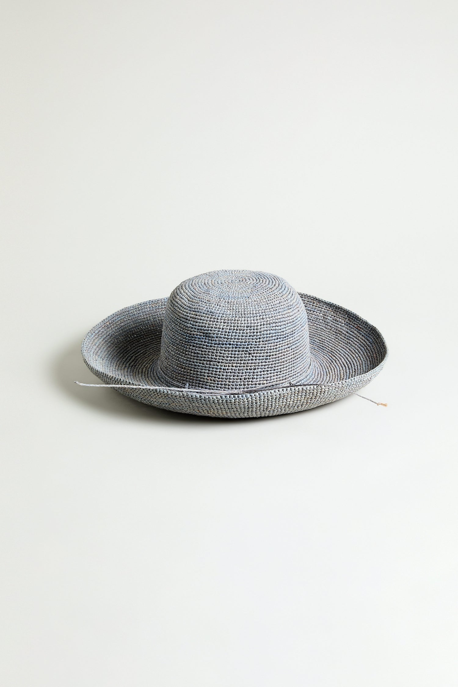 The Handwoven Wide Brim Raffia Hat from Madagascar is shown against a plain white background.