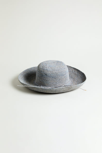 The Handwoven Wide Brim Raffia Hat from Madagascar is shown against a plain white background.