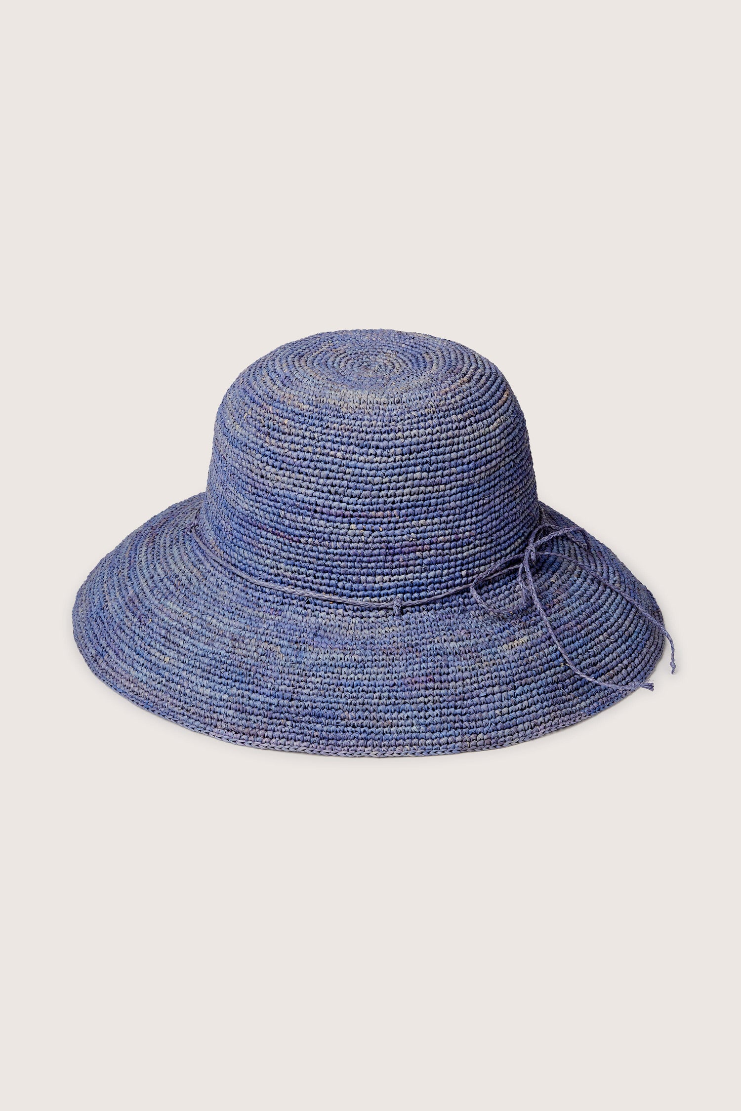 Raffia Hat with a floppy brim and adjustable string, isolated on a white background.