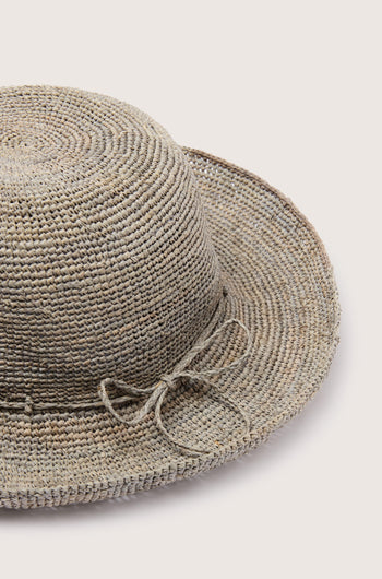 A Woven Raffia Hat with a bow on a white background.