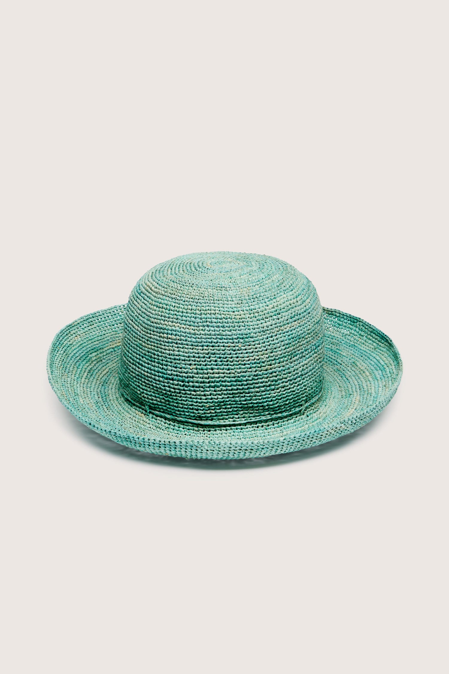 A teal-colored Woven Raffia Hat isolated on a white background.