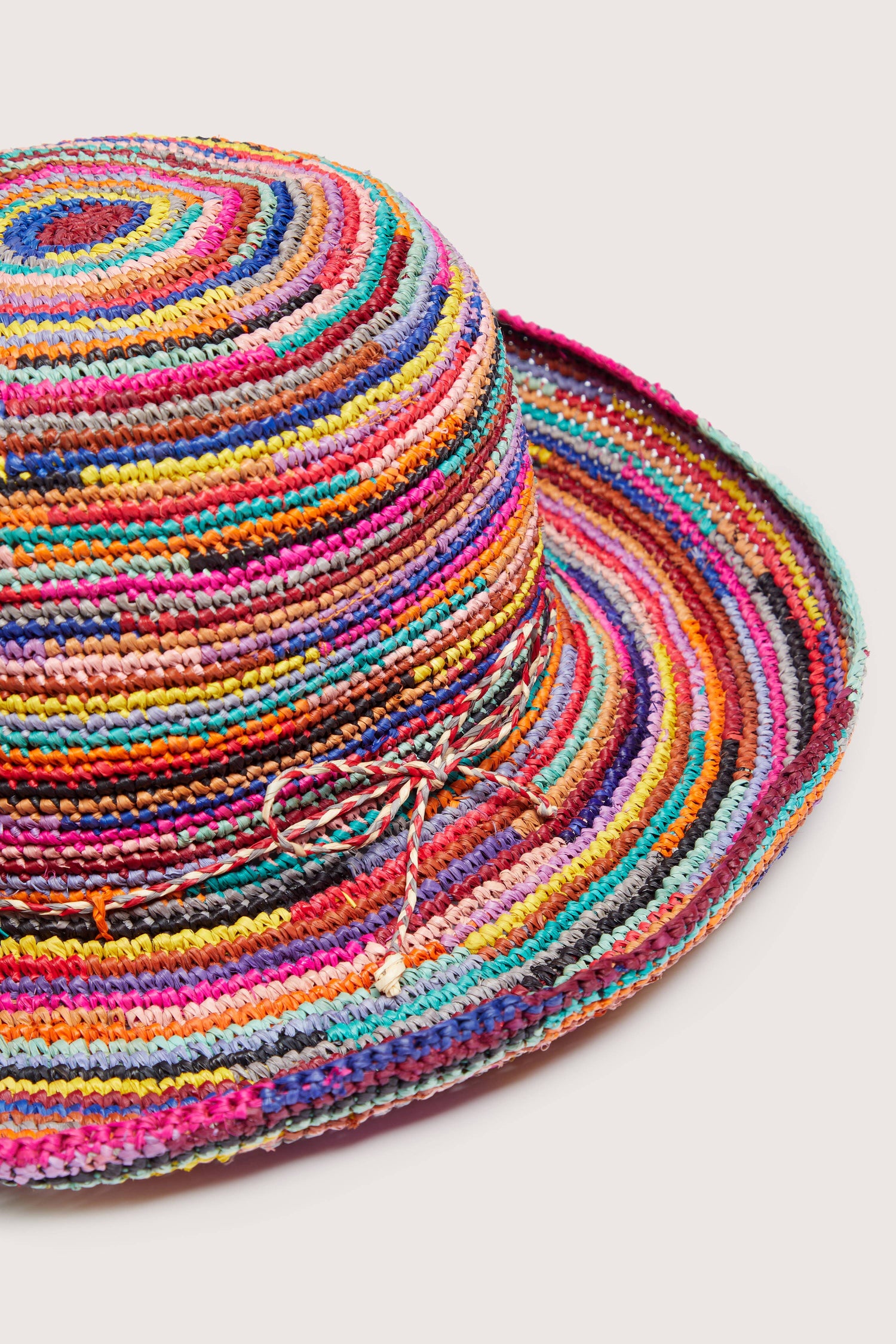 Woven Rainbow Raffia Hat with a brim and chin strap.