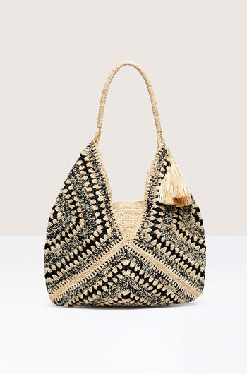 Woven Bohemian Raffia Bag with black and natural patterns and a tassel detail, crafted from Bohemian Raffia in Madagascar.