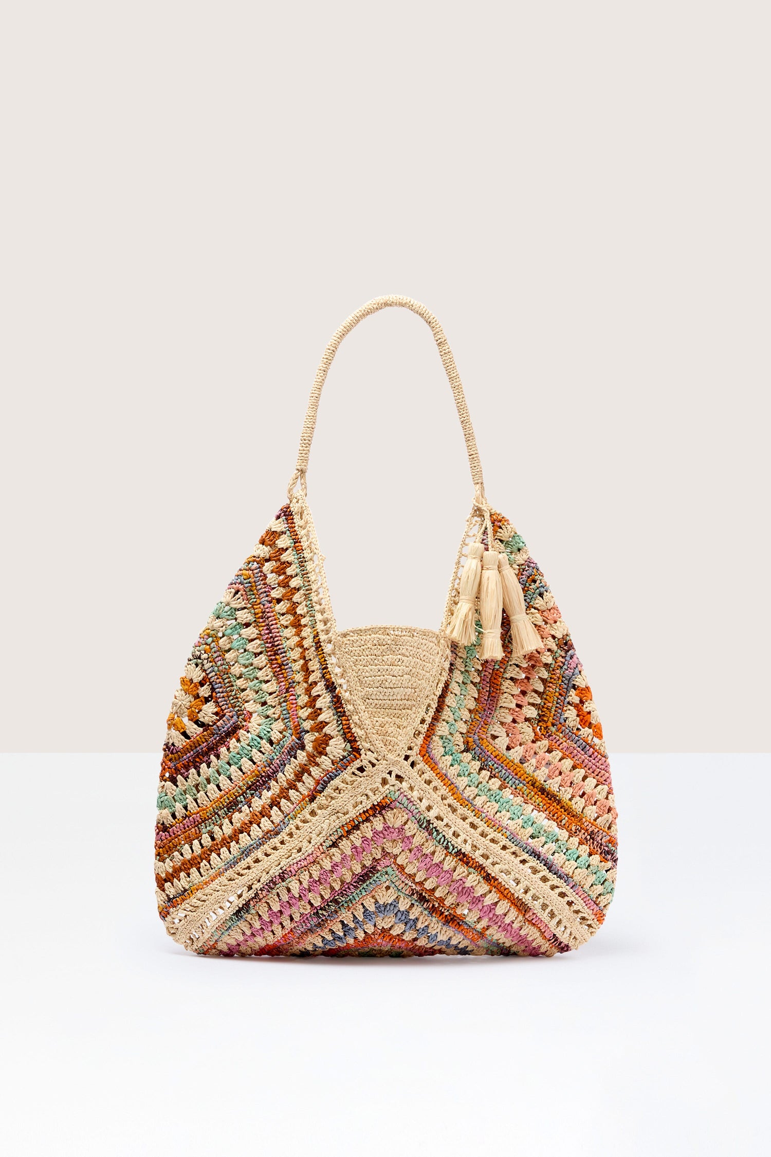 Colorful crocheted Woven Bohemian Raffia Bag on a neutral background.