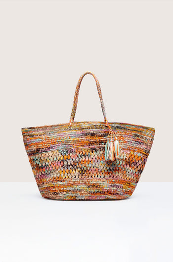 Hand-crafted Woven Rainbow Raffia Bag by Madagascar artisans, set against a neutral background.