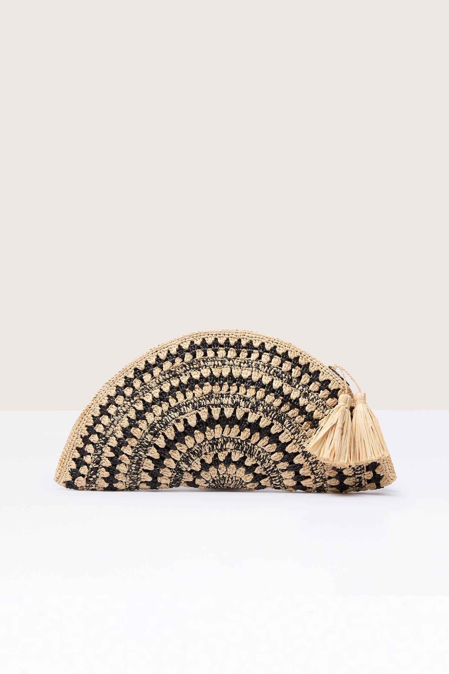 Semi-circular woven raffia clutch bag with tassel detail on a neutral background.

Product Name: Woven Half Moon Raffia Clutch