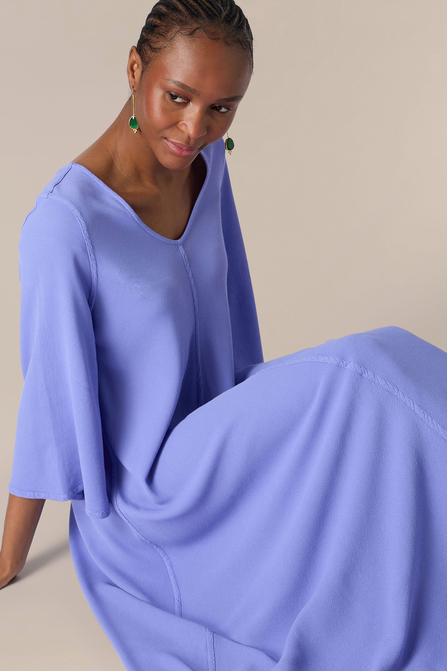 Woman in a stylish blue Crepe Maxi Dress posing for the camera.