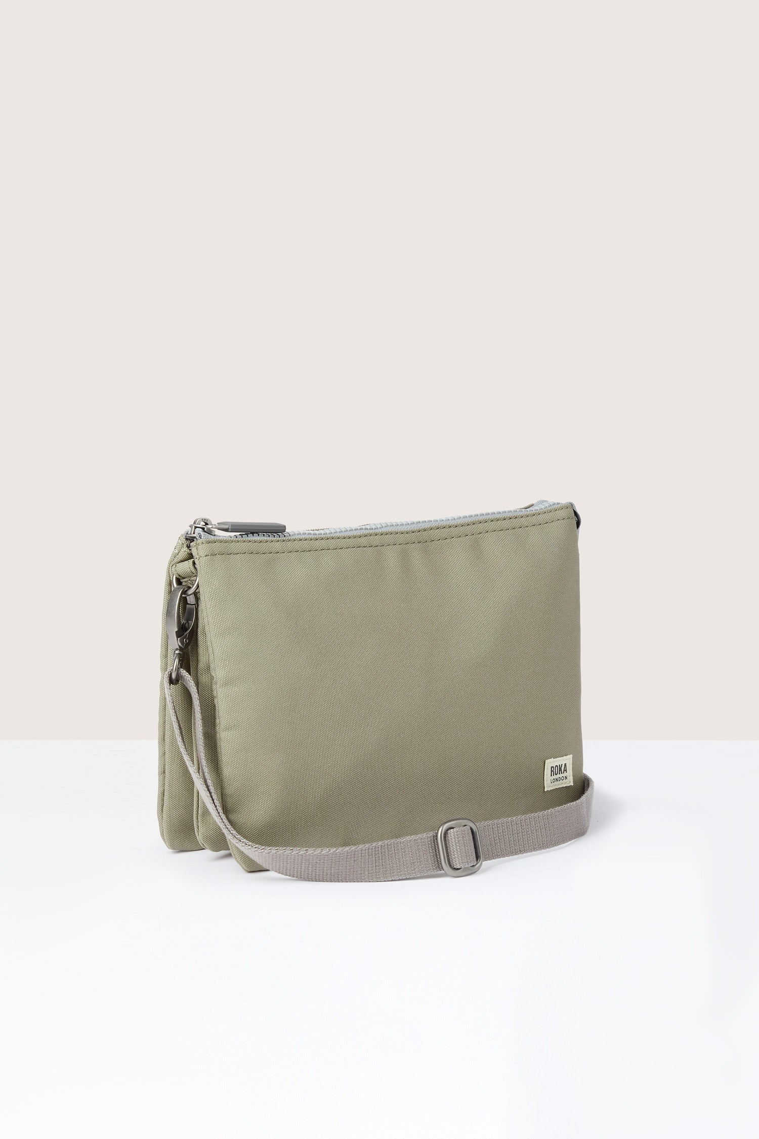 This sage green Vegan Leather Crossbody Bag is lightweight and weather-resistant.