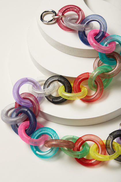 An eye-catching chain bracelet with colorful aluminium Rainbow Rings Necklace on a white surface.