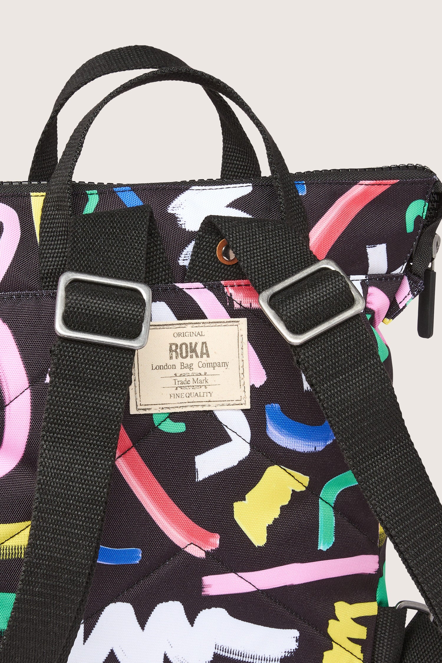 A Recycled Scribble Print Bantry Bag adorned with colorful scribbles, made from recycled bottles.