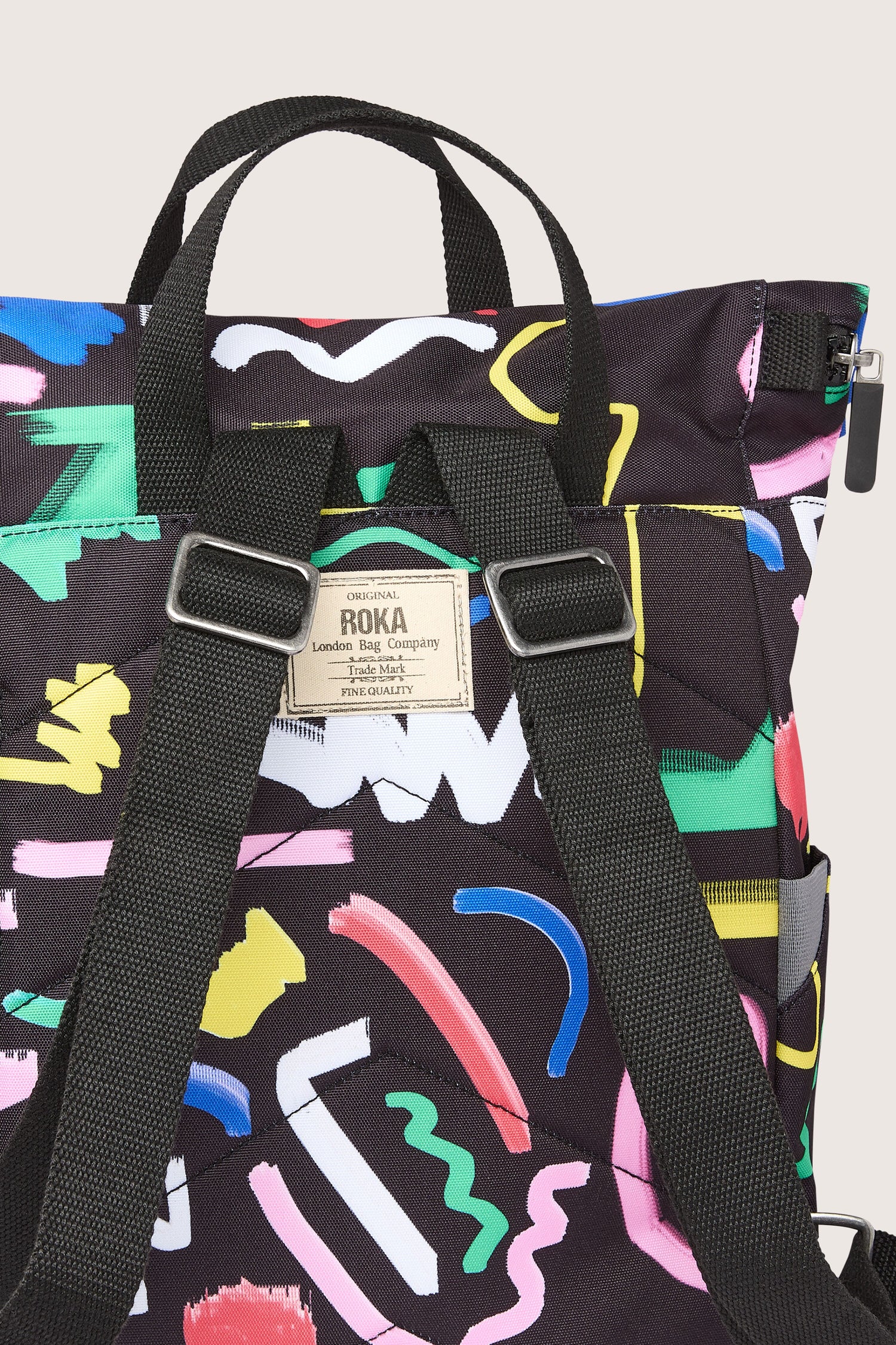 A Recycled Canfield Scribble Print Bag made from recycled bottles, adorned with colorful scribbles.