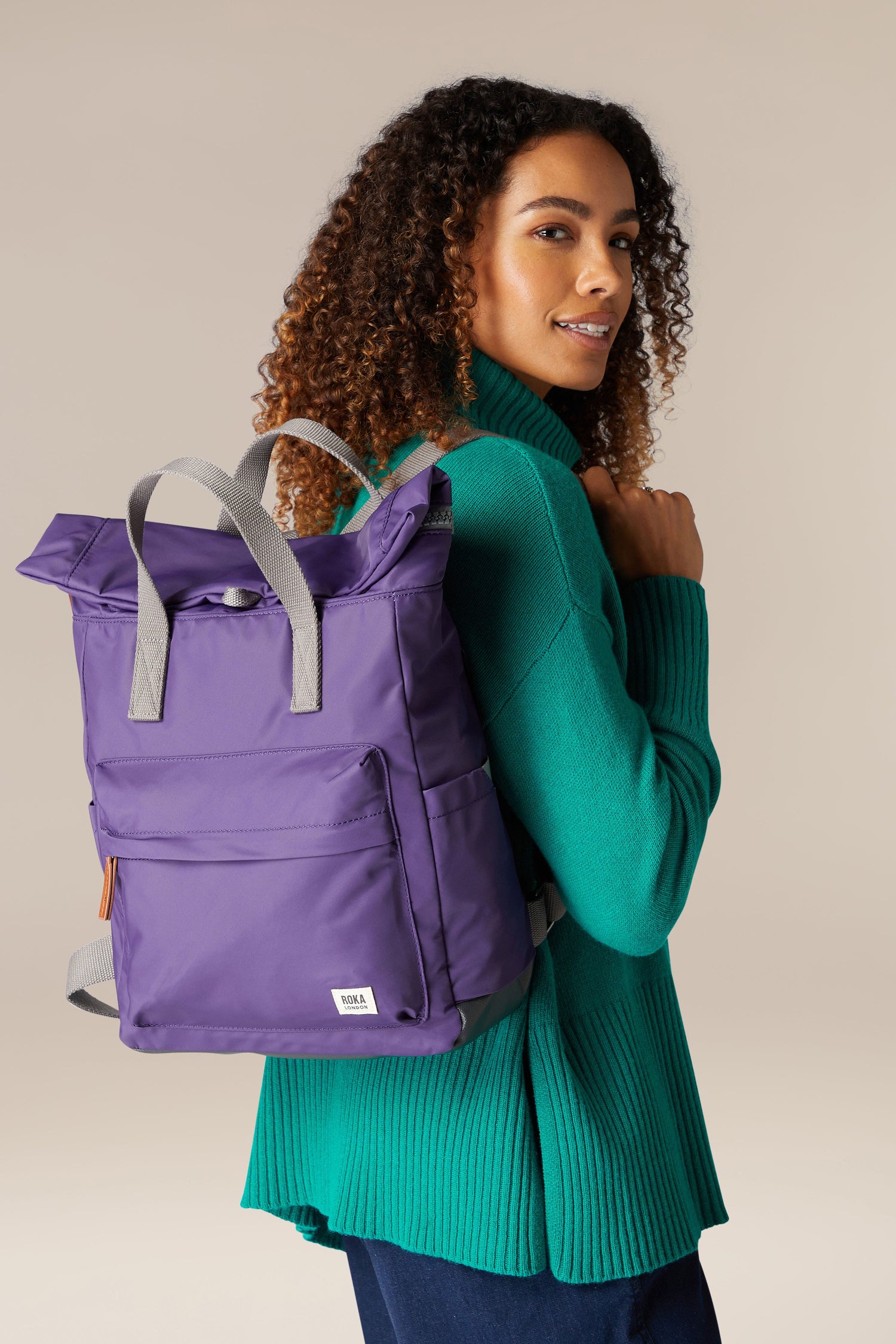 A weather-resistant Recycled Canfield Bag woman's purple backpack with ample storage.