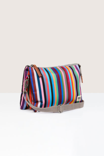 A Recycled Canvas Carnaby Crossbody Bag featuring multi-colored stripes.