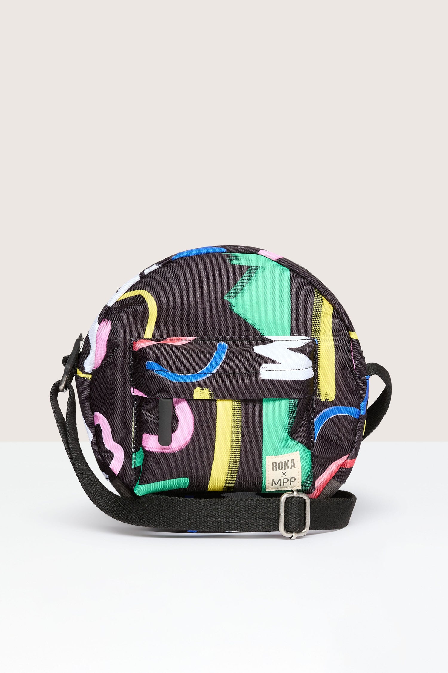 A weather-resistant Recycled Scribble Print Paddington Bag with colorful prints, perfect for vegans on the go.