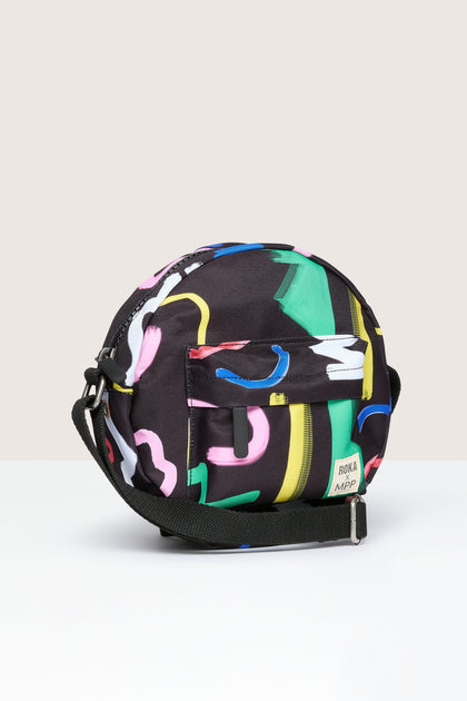 A vegan Recycled Scribble Print Paddington Bag with colorful prints, suitable for a crossbody style and weather-resistant.