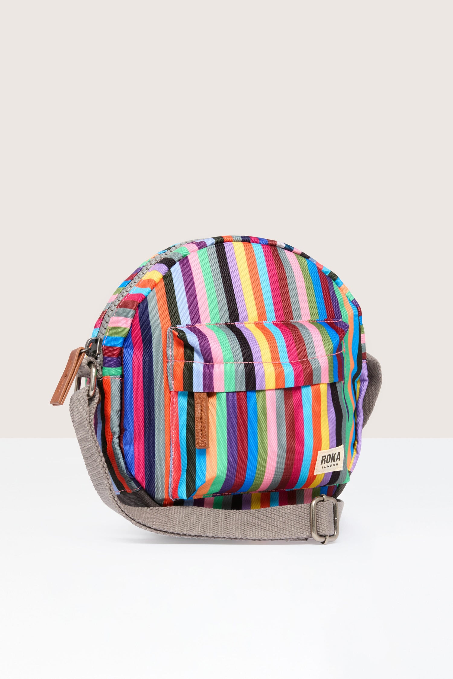 A colorful striped lightweight Recycled Canvas Paddington Bag with a strap.