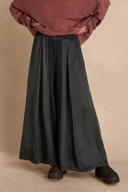 Petrol Wide Leg Panel Trousers in dark green with a gathered waist, paired with a maroon sweater and dark brown lug-sole boots.