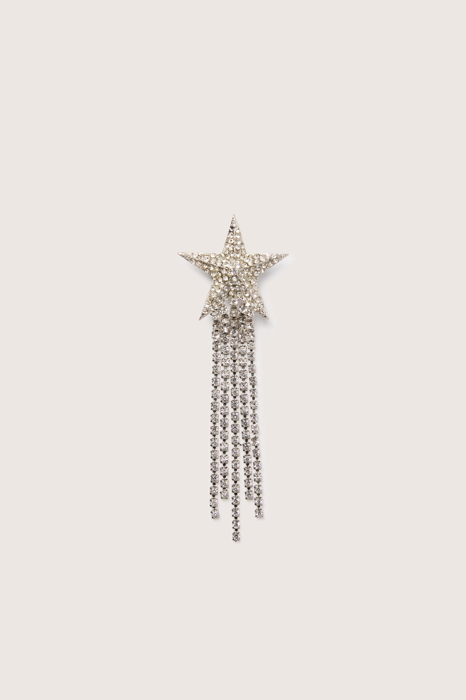 A sparkling Shooting Star Brooch with tassels on a white background.