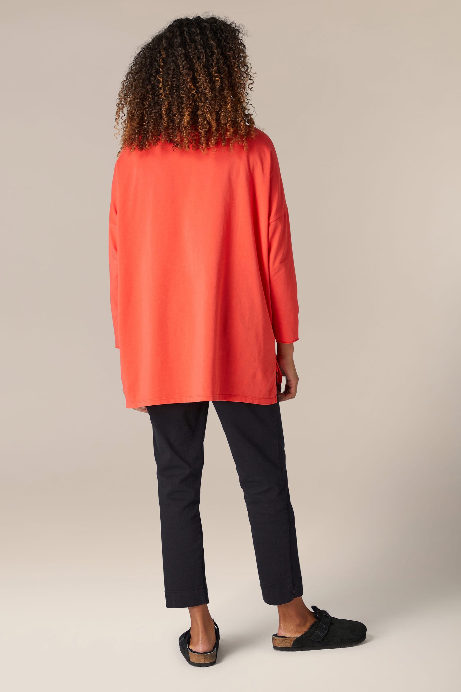 The back view of a woman wearing a comfortable Cotton Jersey Relaxed Top.