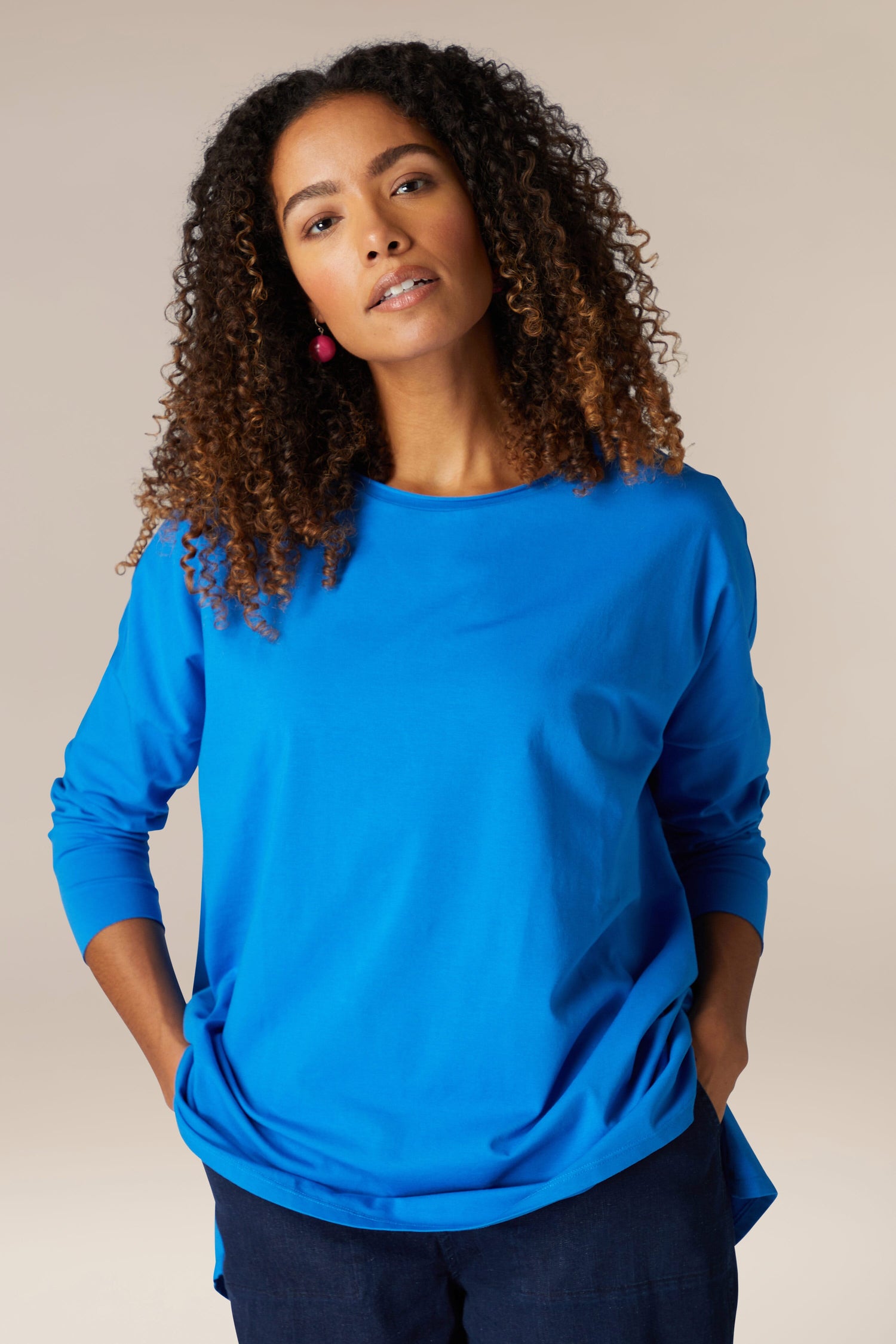 A woman wearing a comfortable blue Cotton Jersey Relaxed Top.