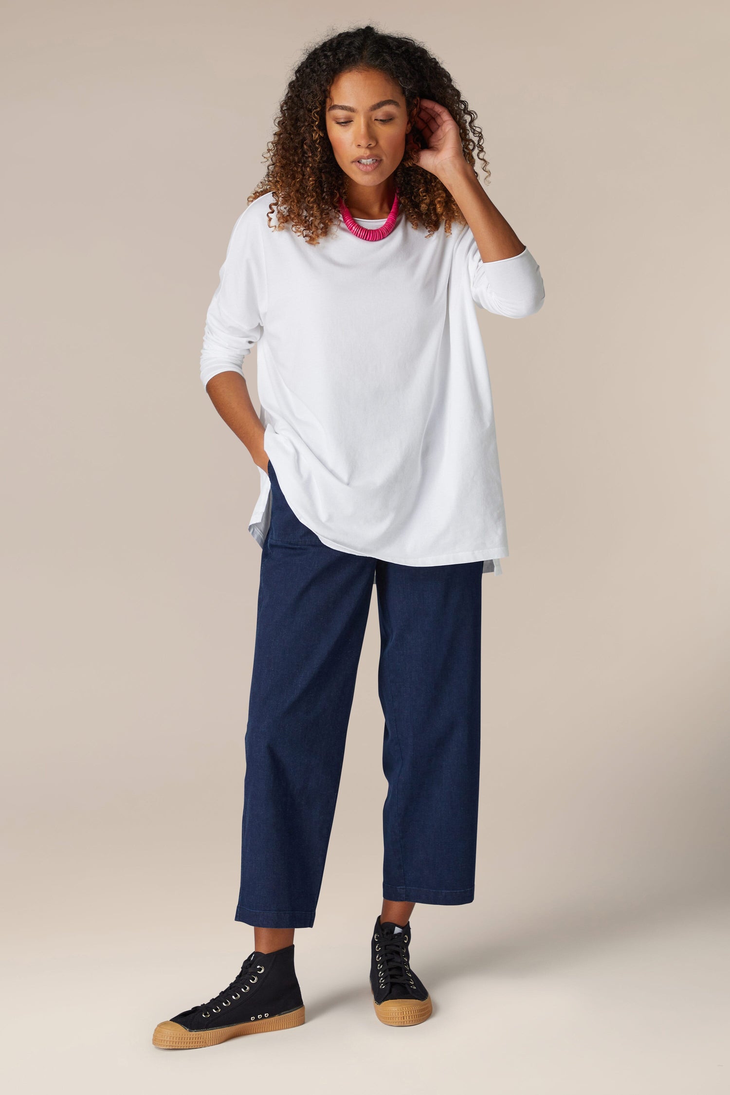 Cotton Jersey Relaxed Top: A woman wearing a comfortable white t-shirt.