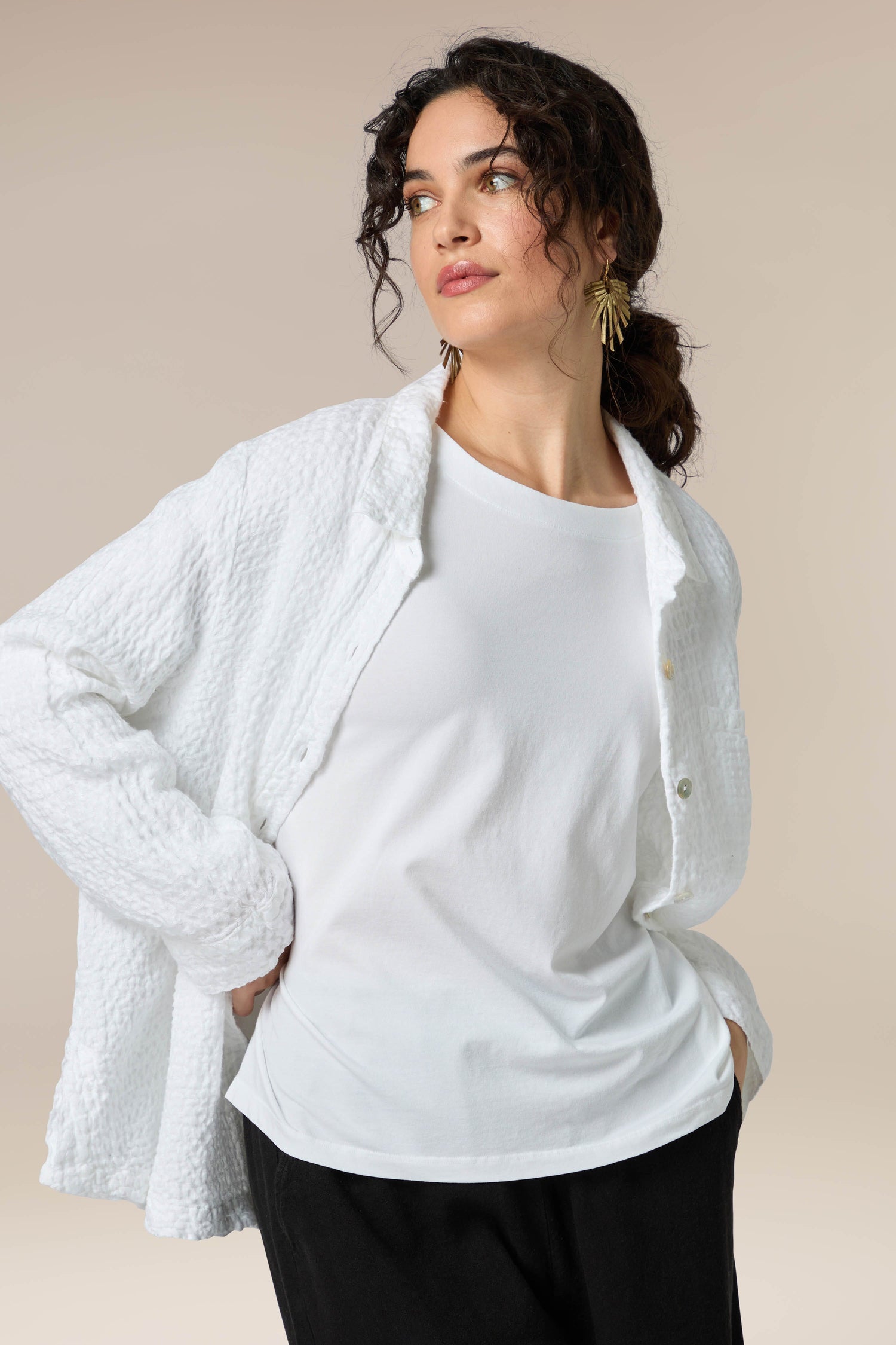 A versatile Cotton Jersey Drapey Top for any occasion, paired with black pants.