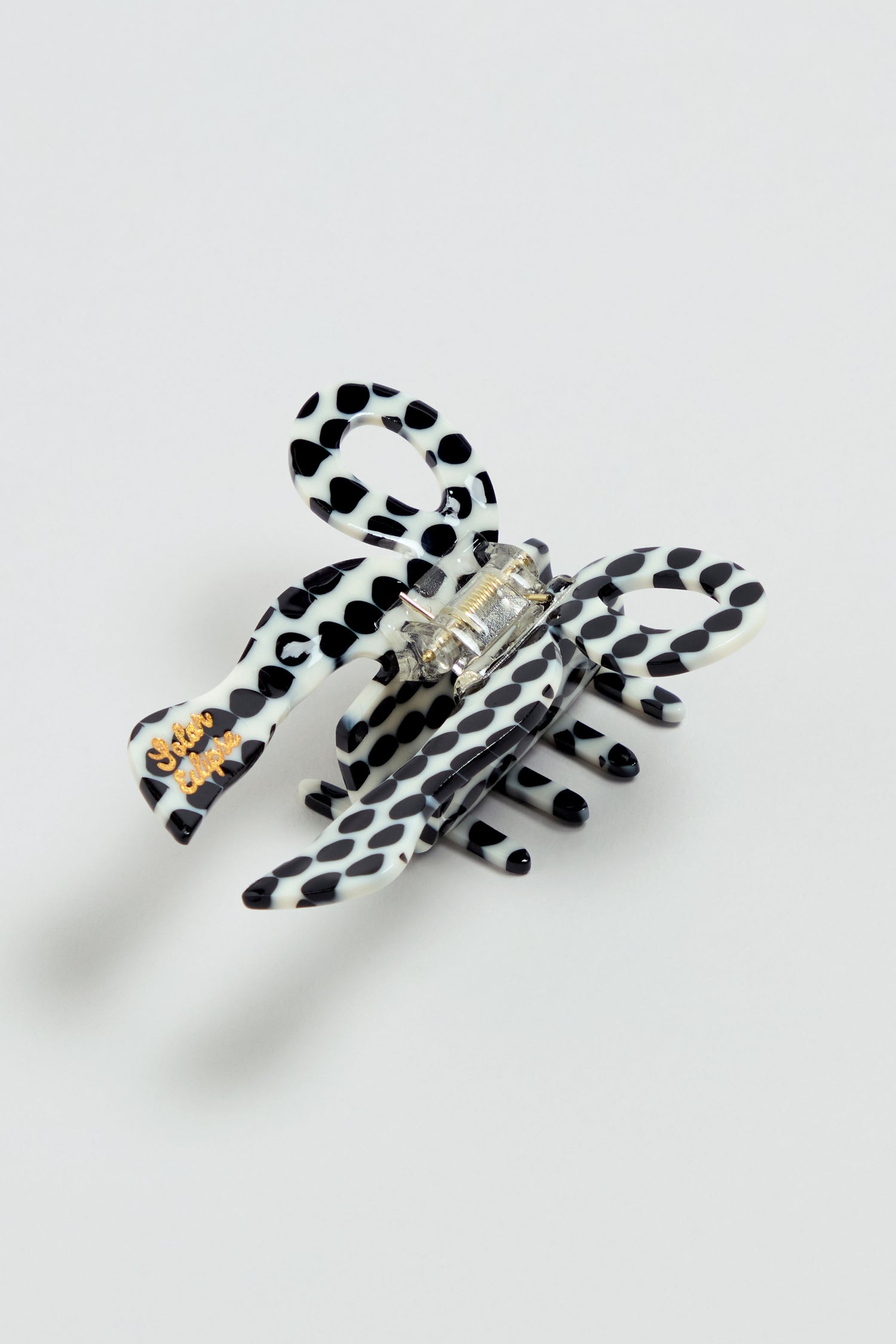 Hand-painted Coquette Bow Hair Clip, crafted from durable cellulose acetate with a secure metal clasp. Shown on a plain light background.