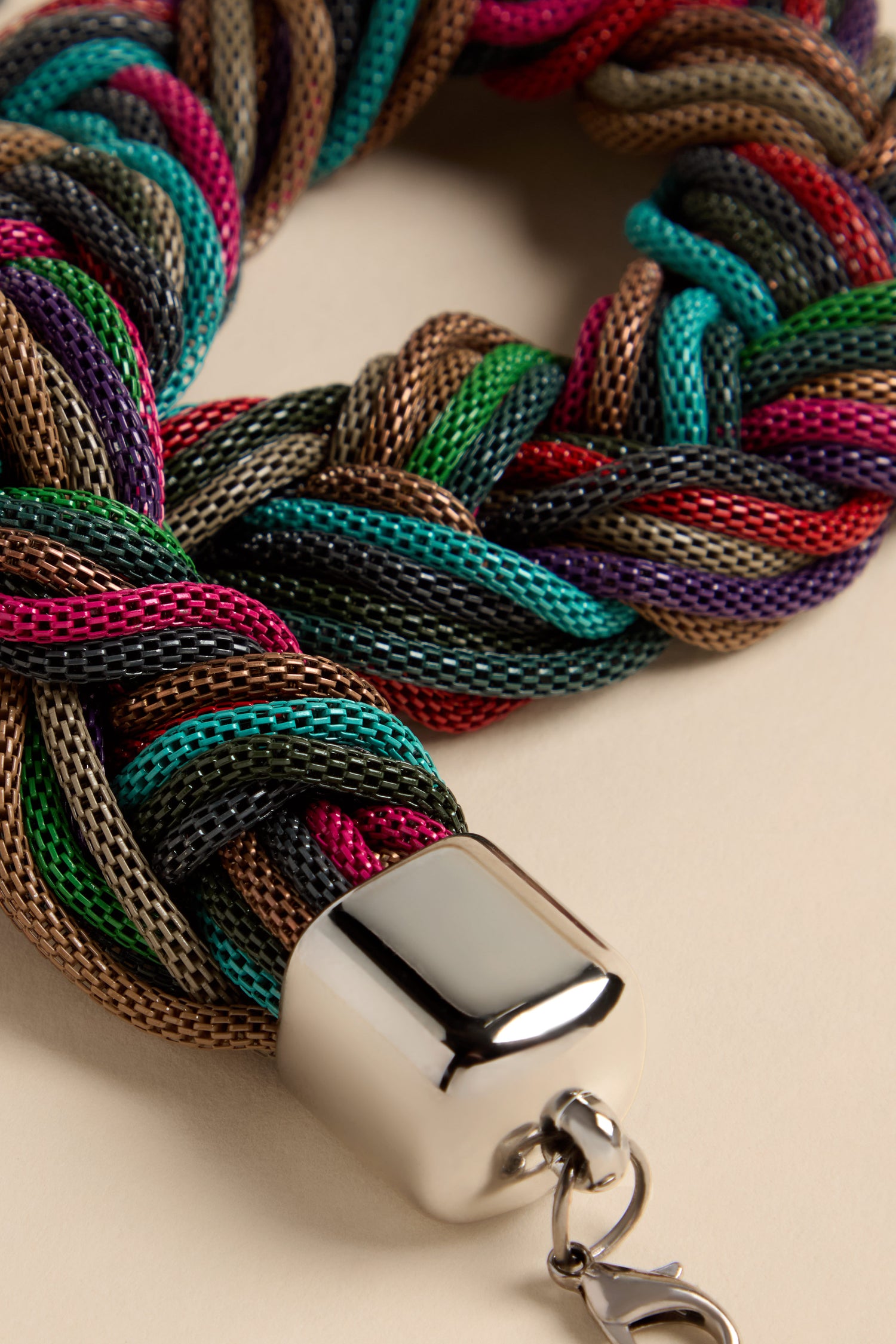 Braided Rainbow Chain Necklace featuring a chunky collar of interwoven purple, green, red, and metallic brown mesh strands with a silver-toned metal clasp.