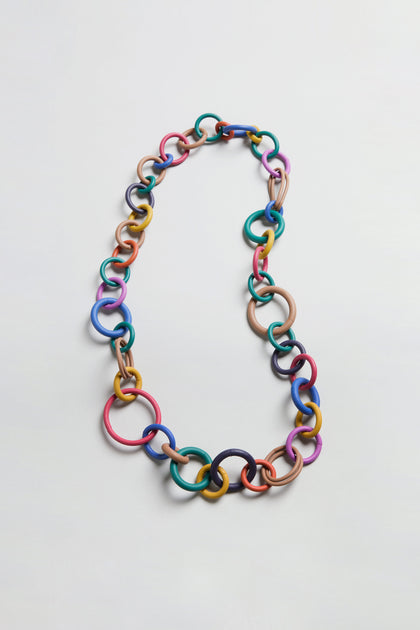 Long Rainbow Hoops Necklace featuring interlocking rubber links in assorted sizes and vibrant rainbow colors, showcased on a plain light background.