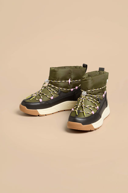 Whitney Quilted Toggle Slip on Boots in olive green with black mudguards, multicolored laces, and thick white and tan insulated soles.