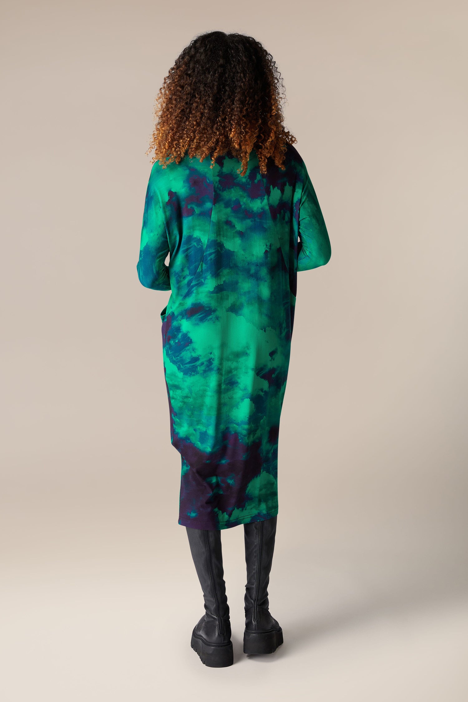 The back view of a woman wearing the Jewelled Sky Jersey Dress, made from Lenzing EcoVero™ Viscose™ in a beautiful sky print.
