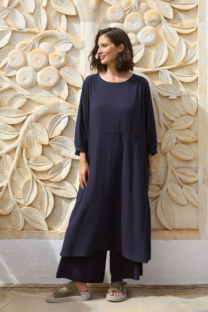 A woman in a blue Crinkle Soft Viscose Flared Dress.