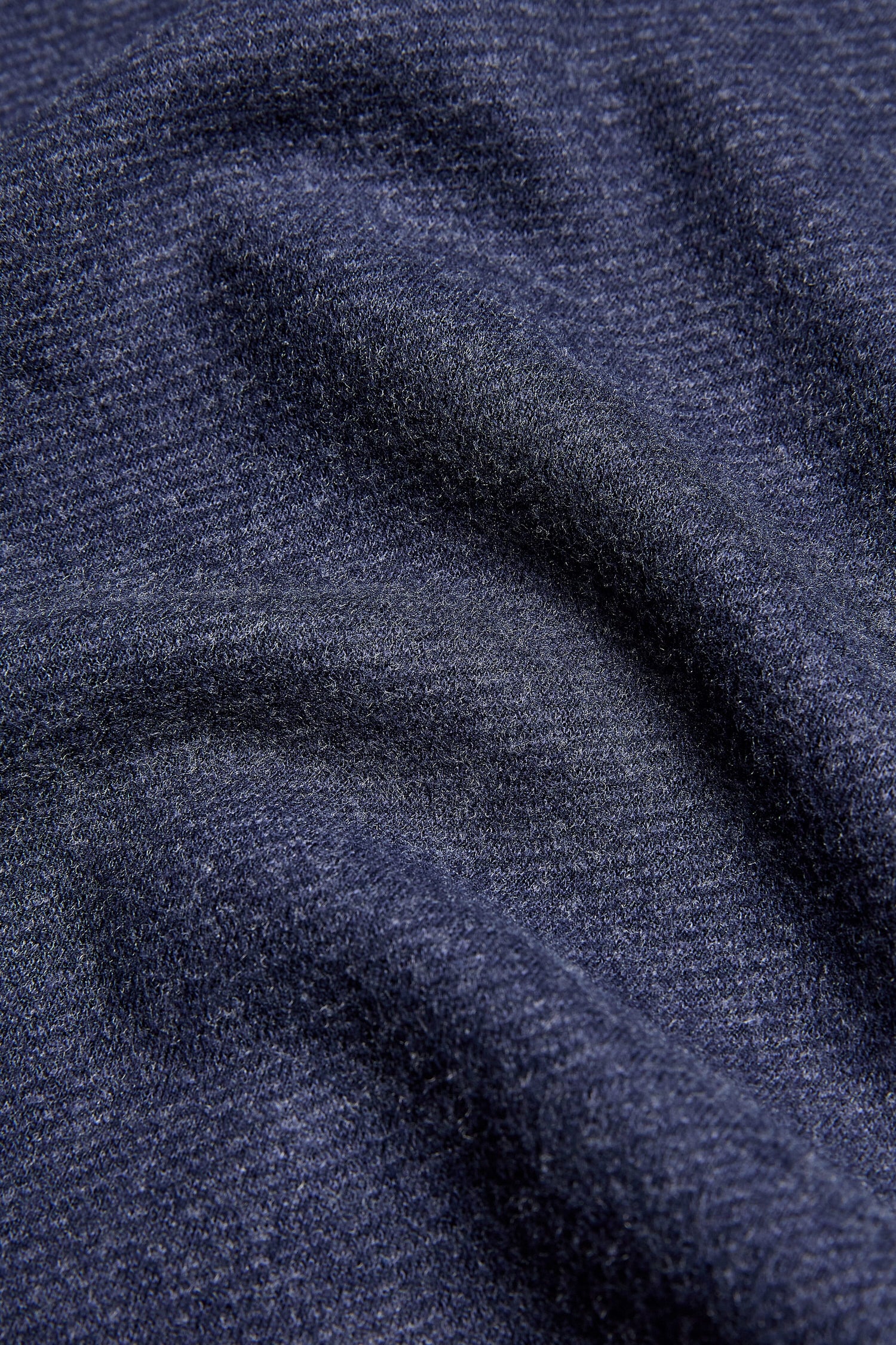 A close up image of a dark blue Marl Jersey Wide Leg Trouser fabric with a wide trousers silhouette.