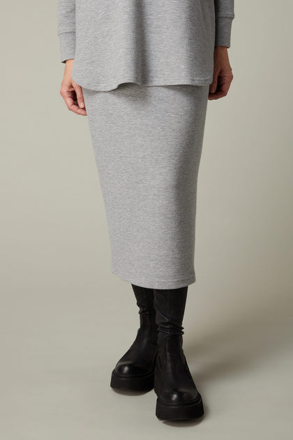 A woman wearing a Crinkle Jersey Tube Skirt.