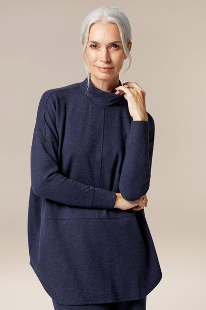 A woman wearing a navy Marl Jersey Sweatshirt, a wardrobe staple for any season.