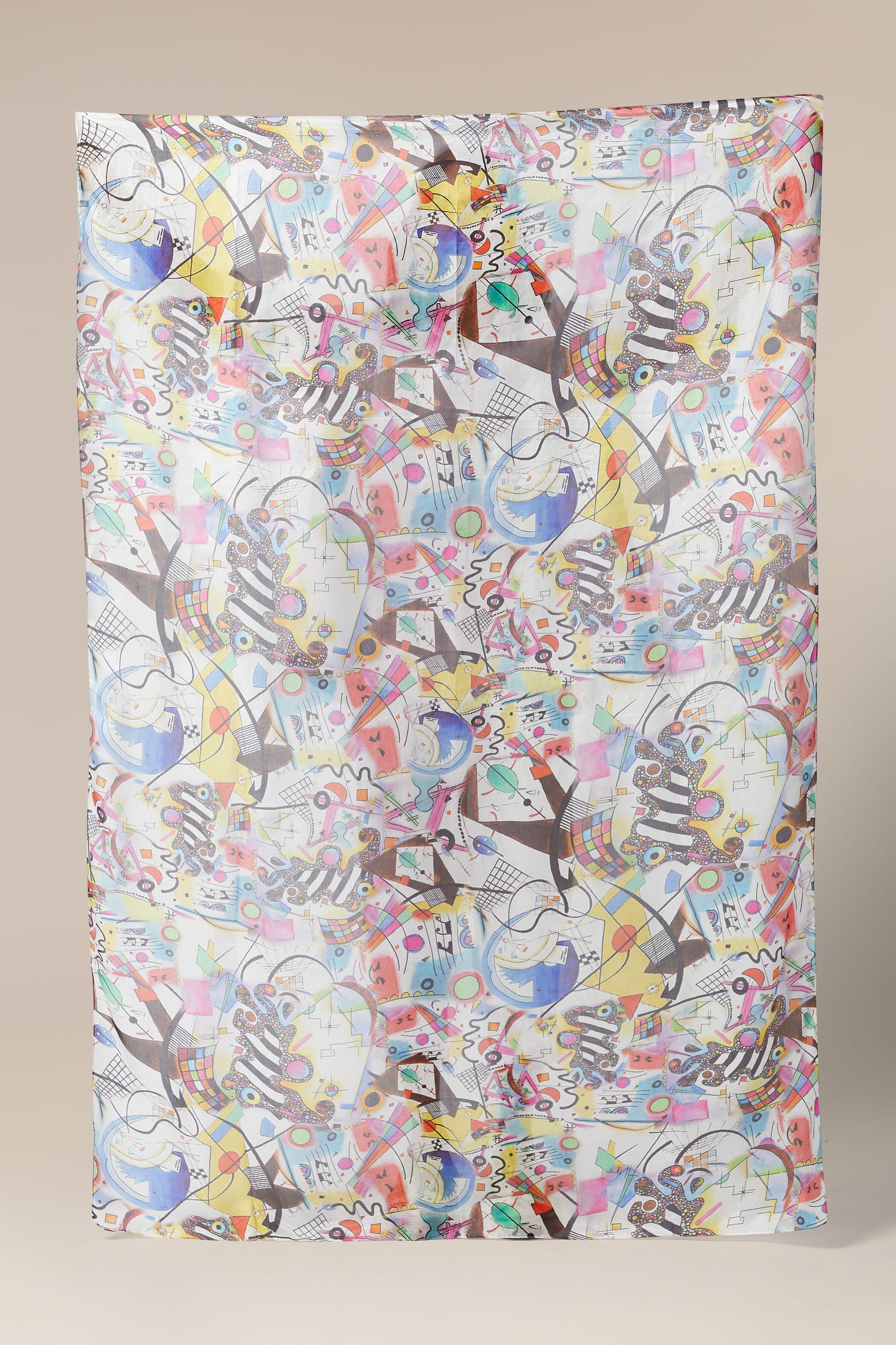 A Cubist Silk Scarf with a colorful pattern on it.