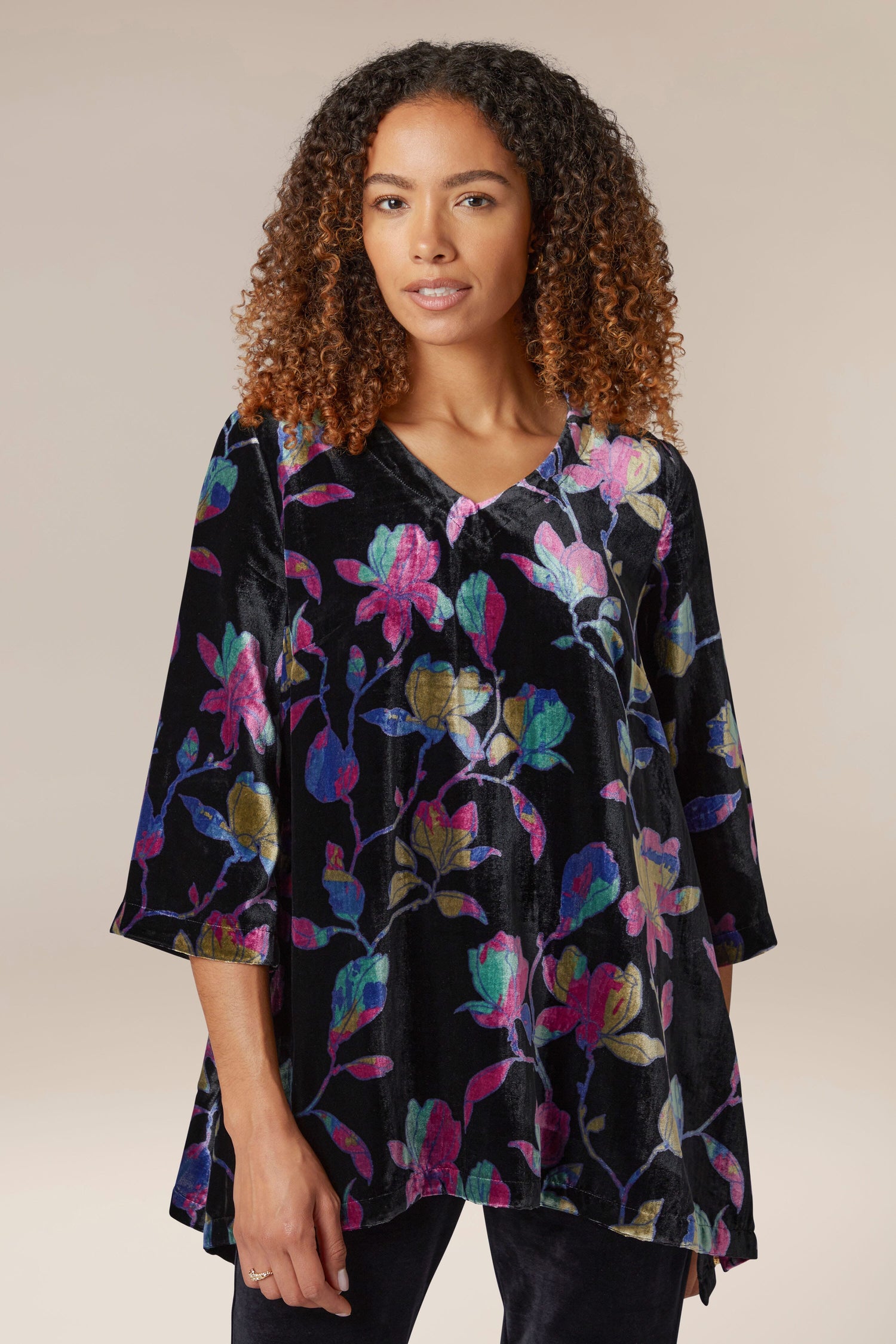 A woman wearing a Winter Magnolia Velvet Tunic.